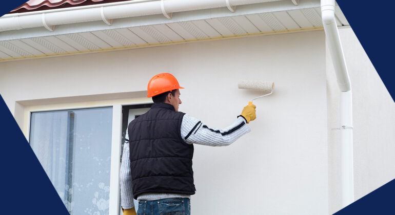 a picture of a man painting the exterior of a home