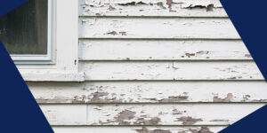 cracked paint on a home's exterior wood siding