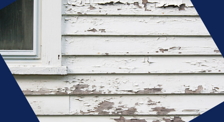 cracked paint on a home's exterior wood siding